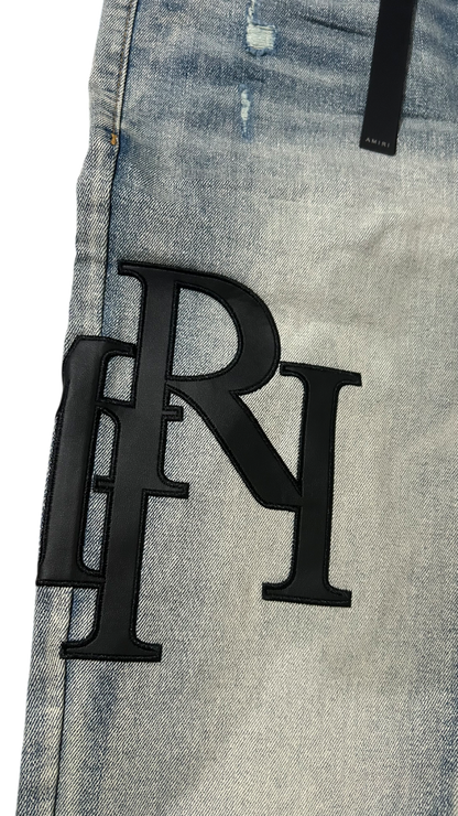 Amiri Black Staggered Logo Blue Jeans
